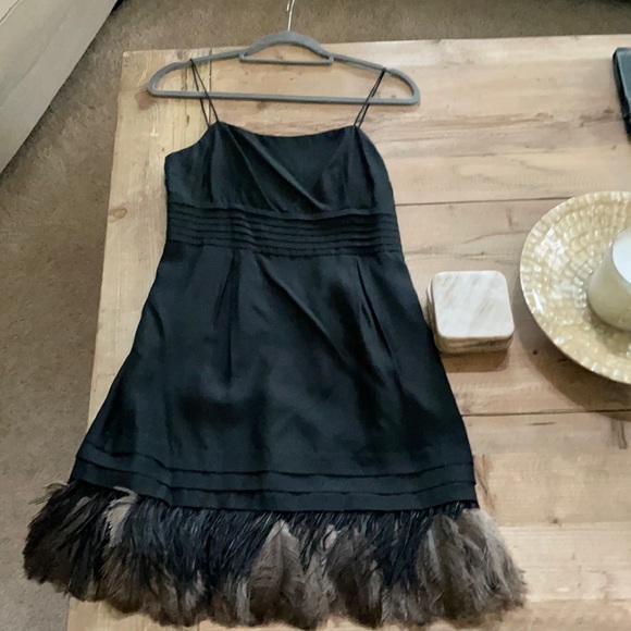 Juicy Couture Dresses & Skirts - Juicy Couture size 2 , black with feathers 🪶 hem